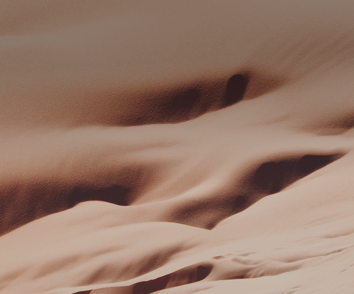 Abstract patterns of smooth desert sand dunes