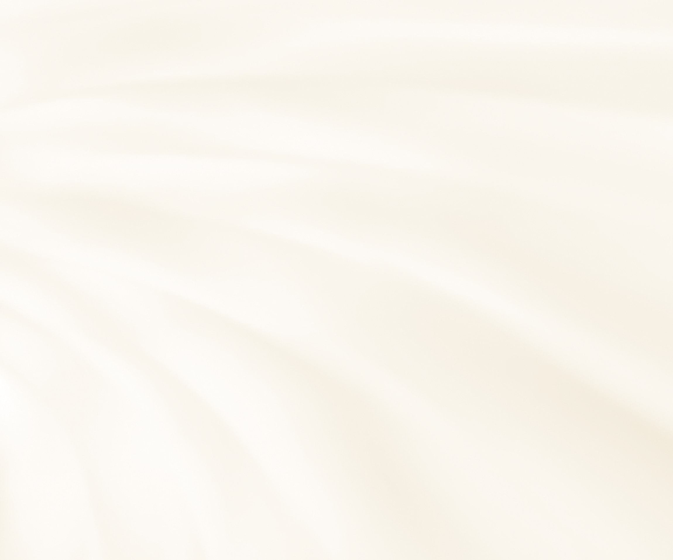 Soft, flowing cream-colored fabric texture background.