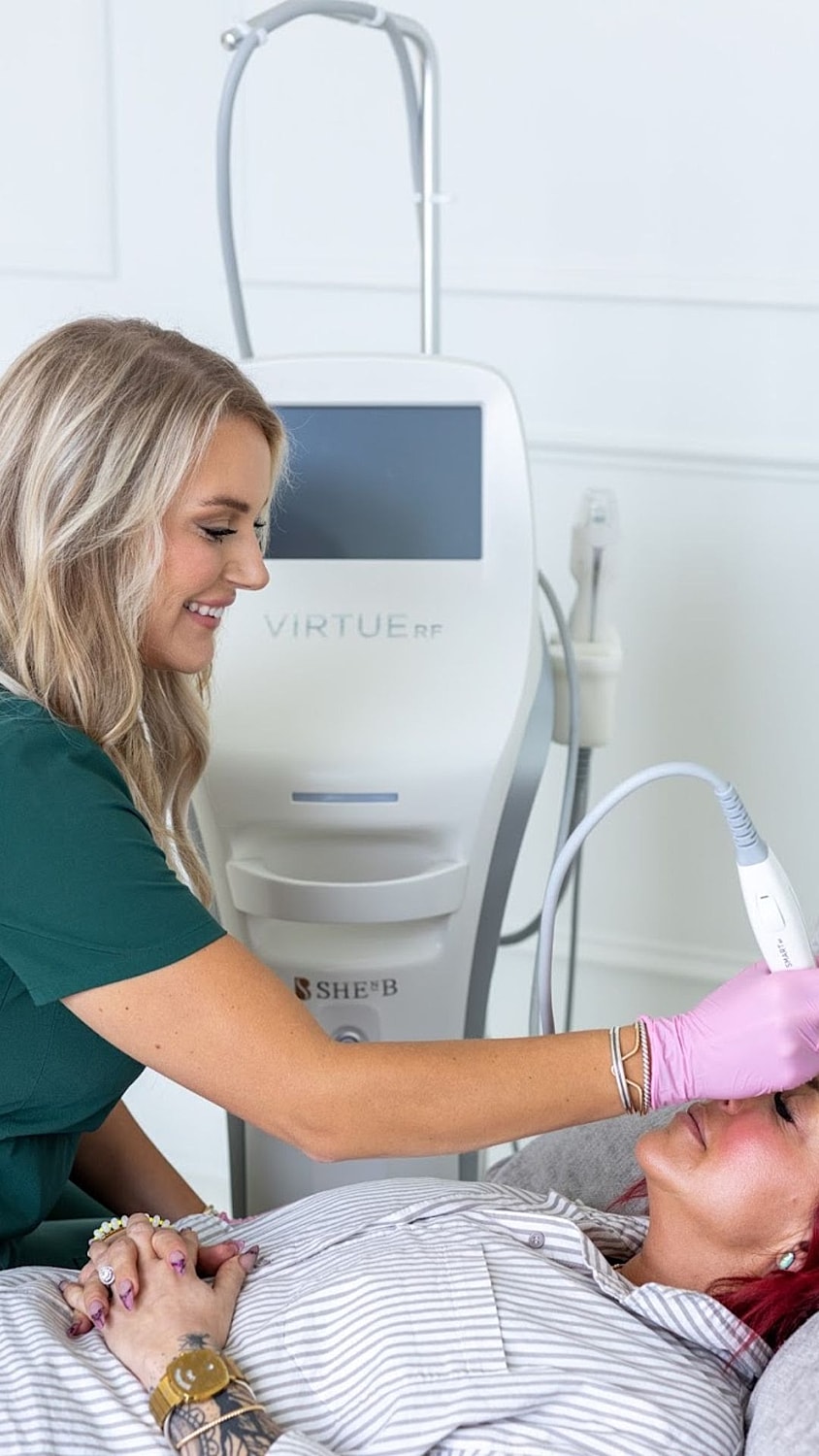 Portrait of a woman with long, wavy hair.