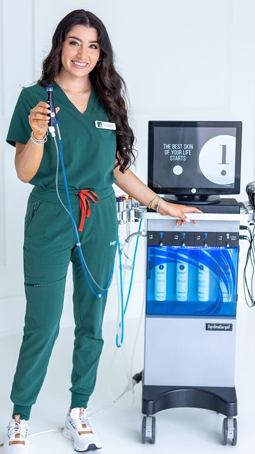 Smiling woman with long, curly hair.