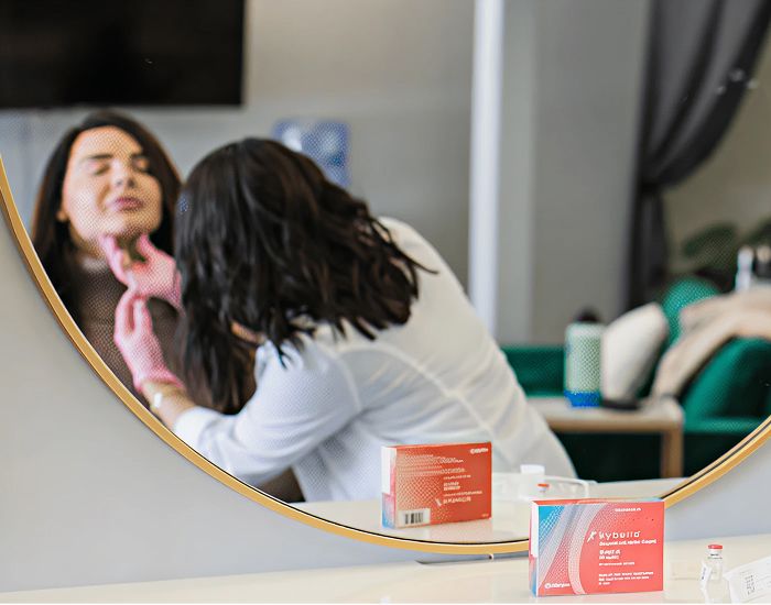 Client receiving skincare treatment in beauty clinic.