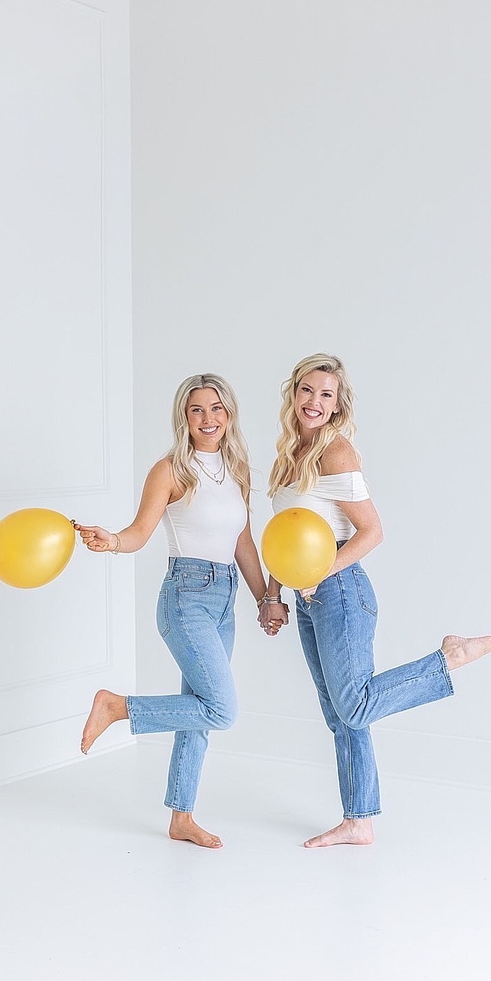 Woman smiling with long hair and natural makeup.