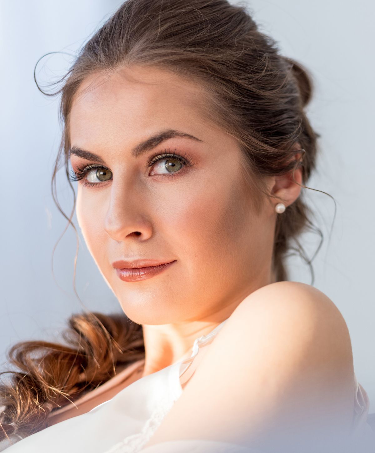 Woman with long hair and natural makeup.