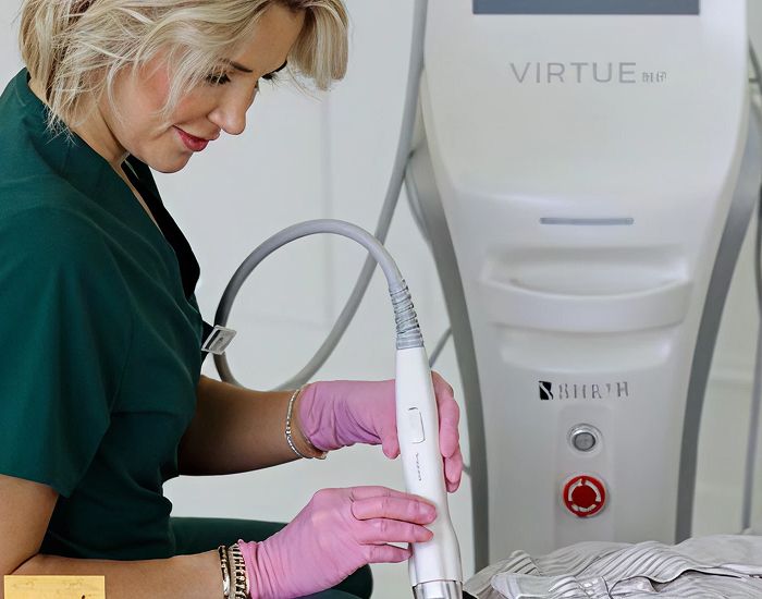 Technician using Virtue RF microneedling device.