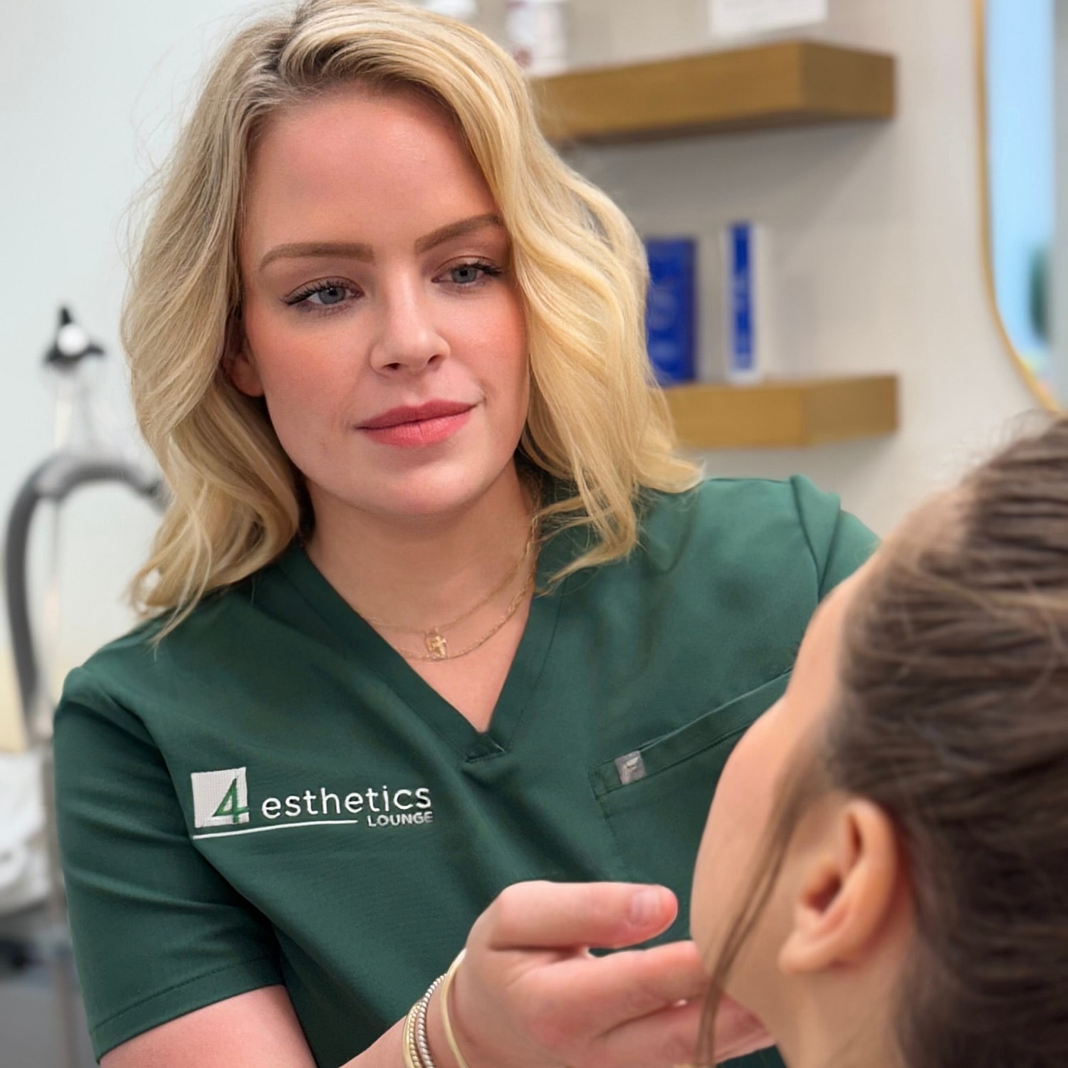 Woman with natural makeup and soft smile.