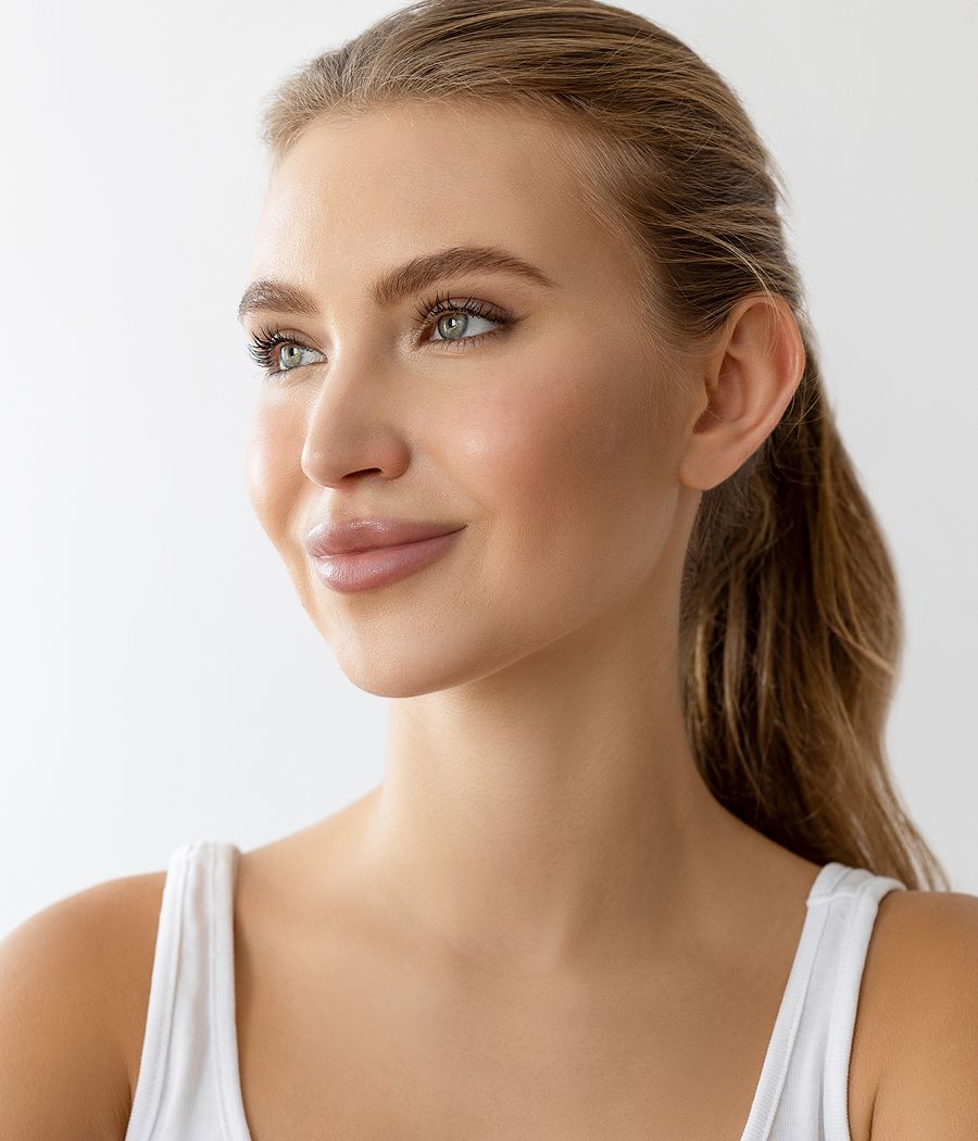 Smiling woman with long hair against white background