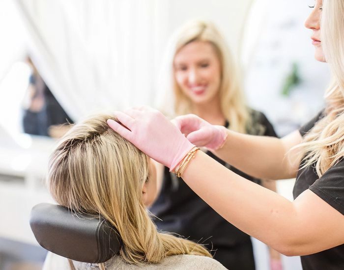 Hair treatment in a modern salon setting.