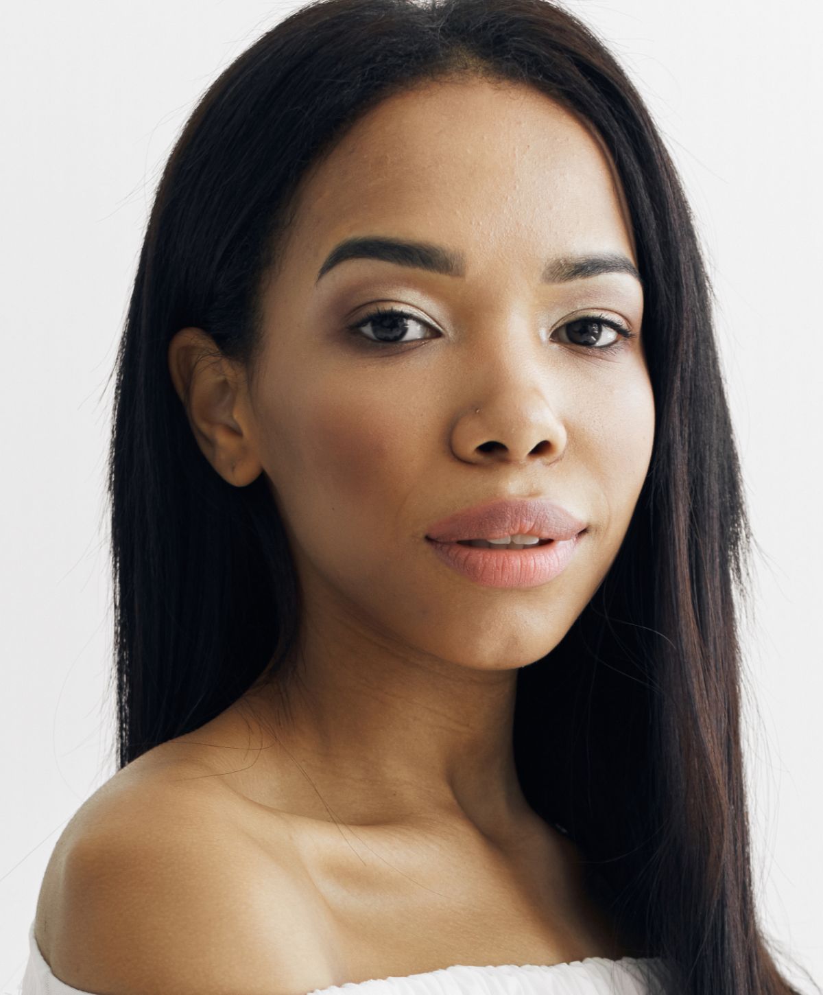 Portrait of a woman with long, dark hair.