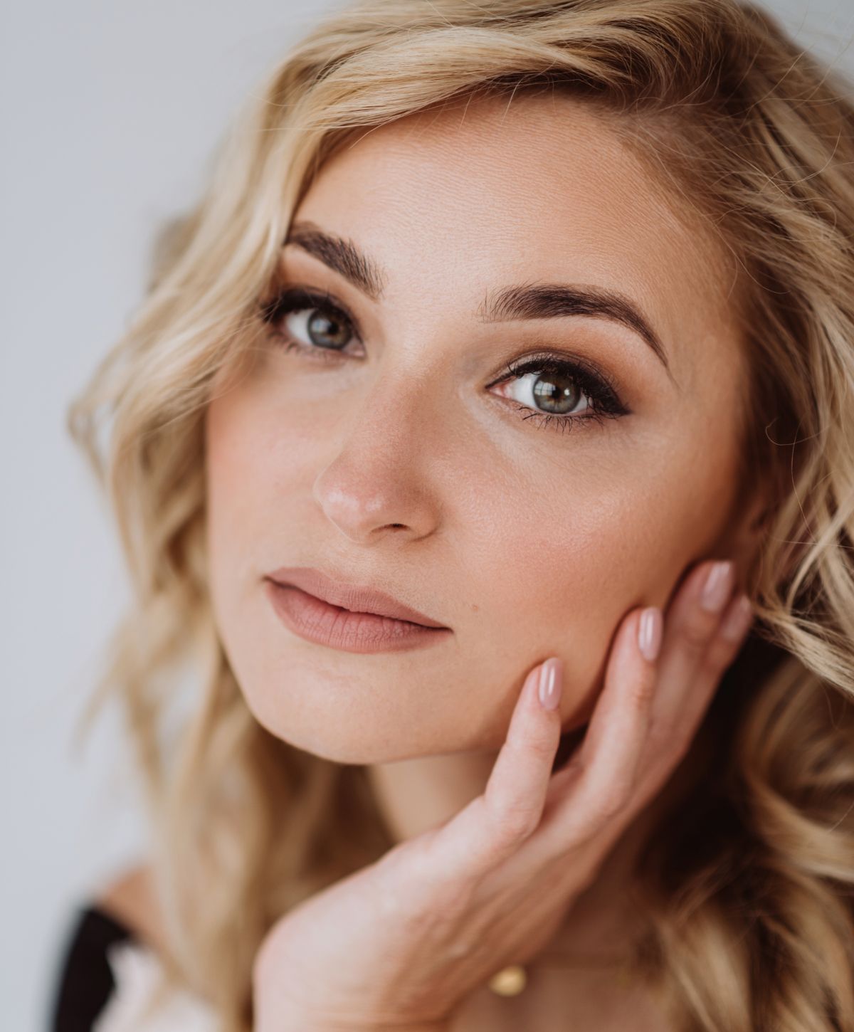 Close-up of a woman with soft makeup.