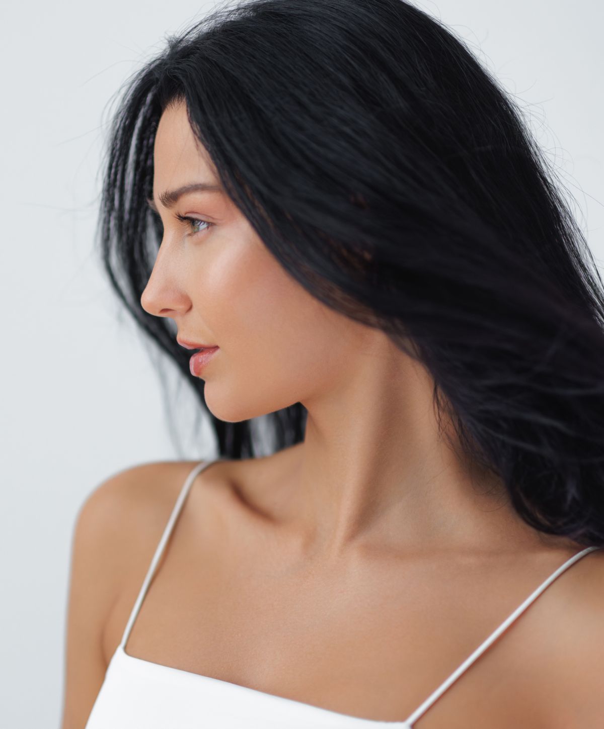 Profile view of a woman with long black hair.