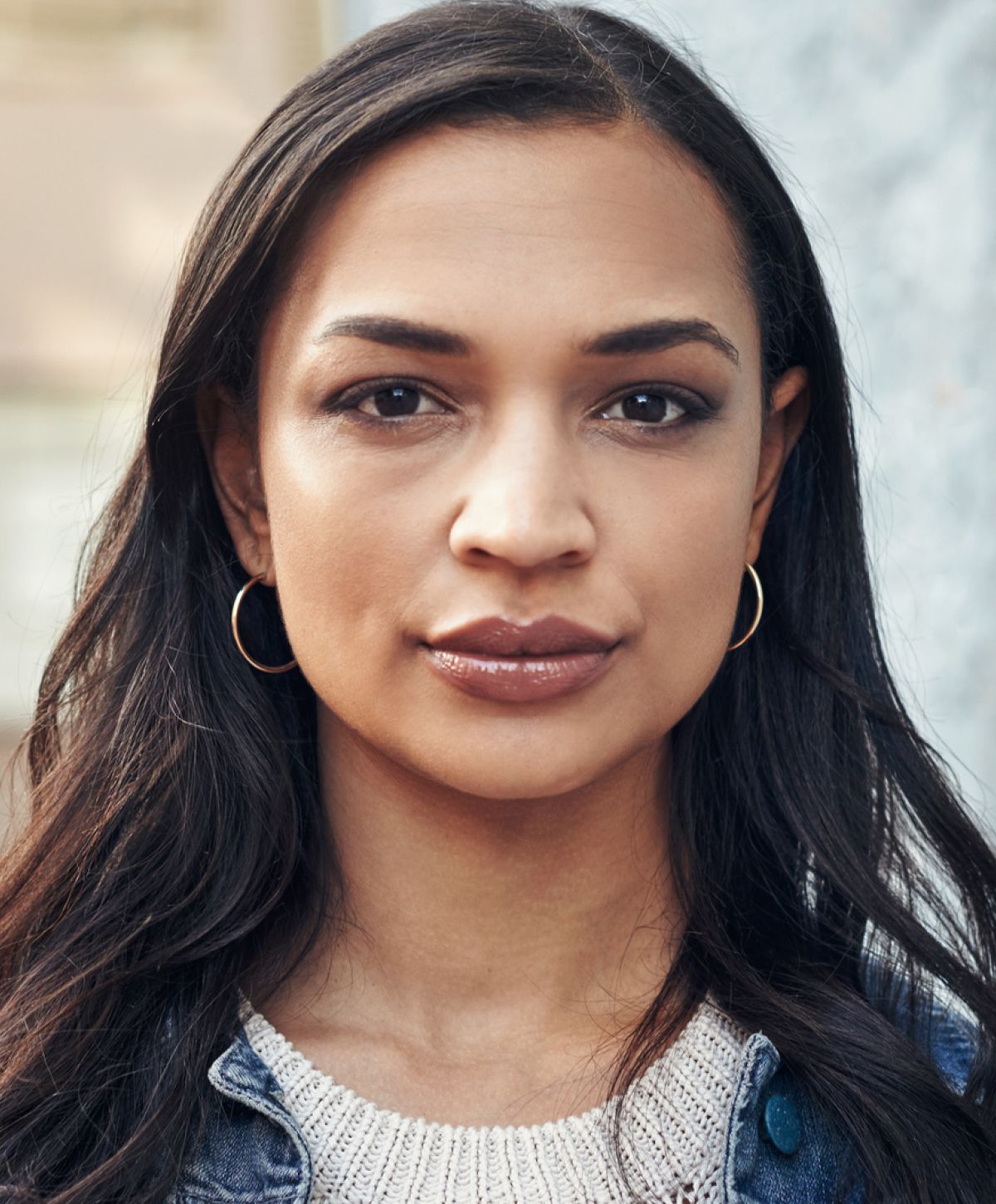 Close-up portrait of a woman with dark hair.