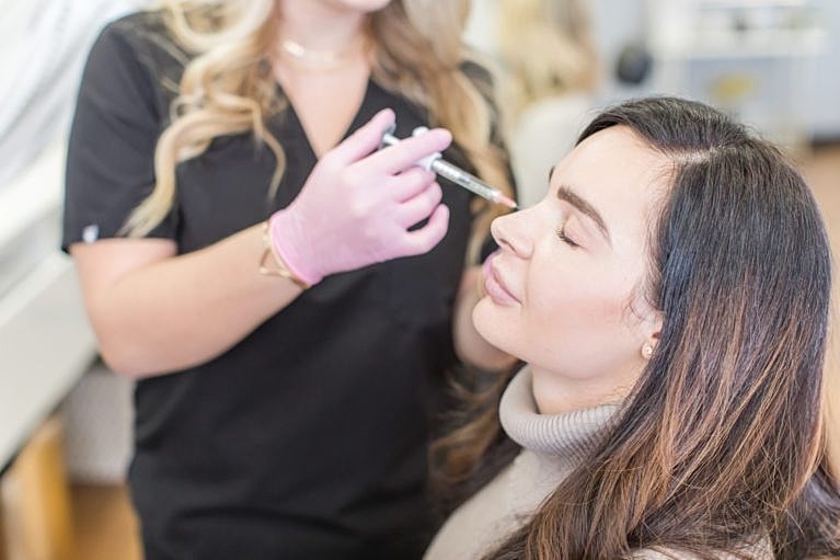 Cosmetic procedure in progress on a client.